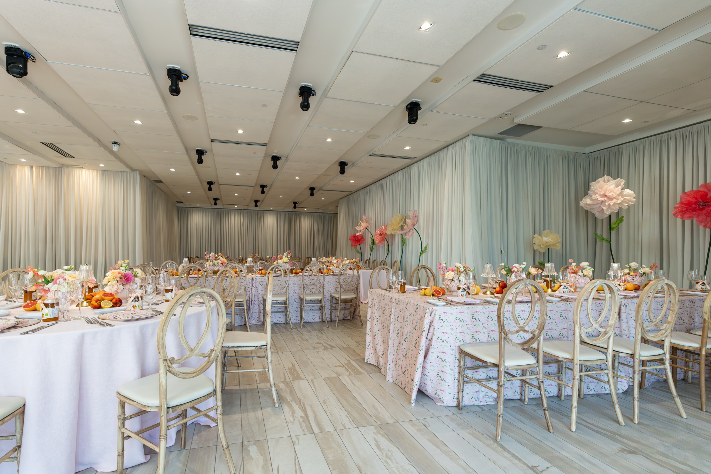 Universal Eventspace set with round and long tables in blush and peach